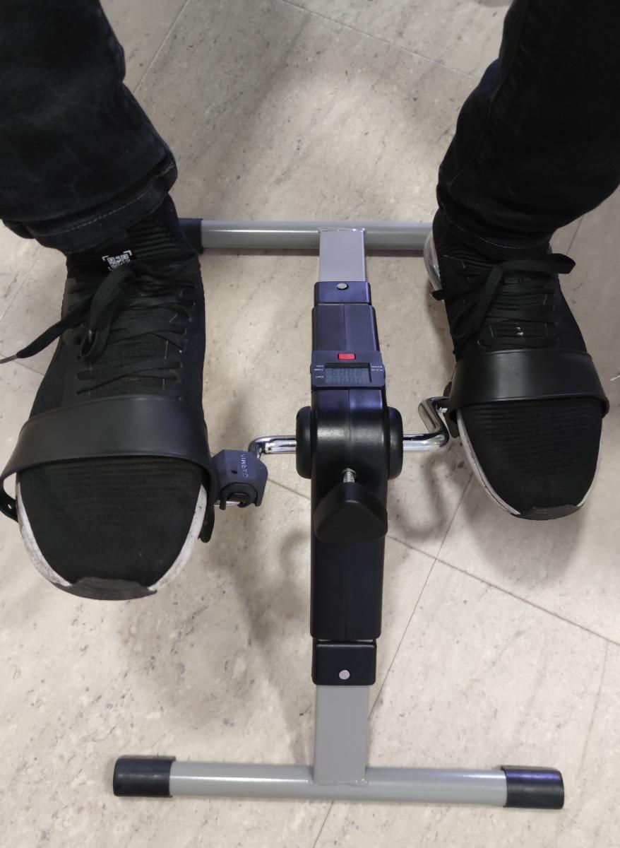 Image showing a member of the technical team performing an Oroi Fit exercise using the pedals