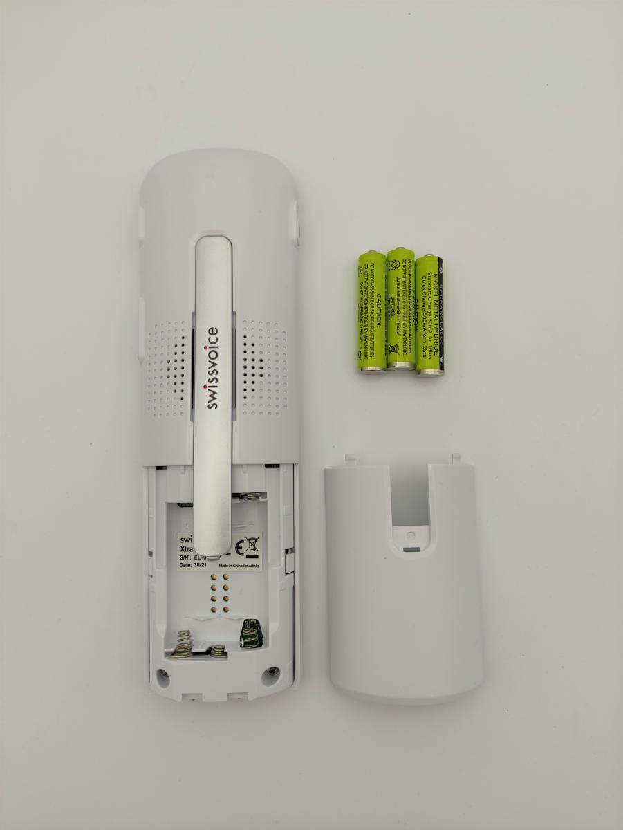 Image of the back slot of the phone open and to the right of the rechargeable batteries