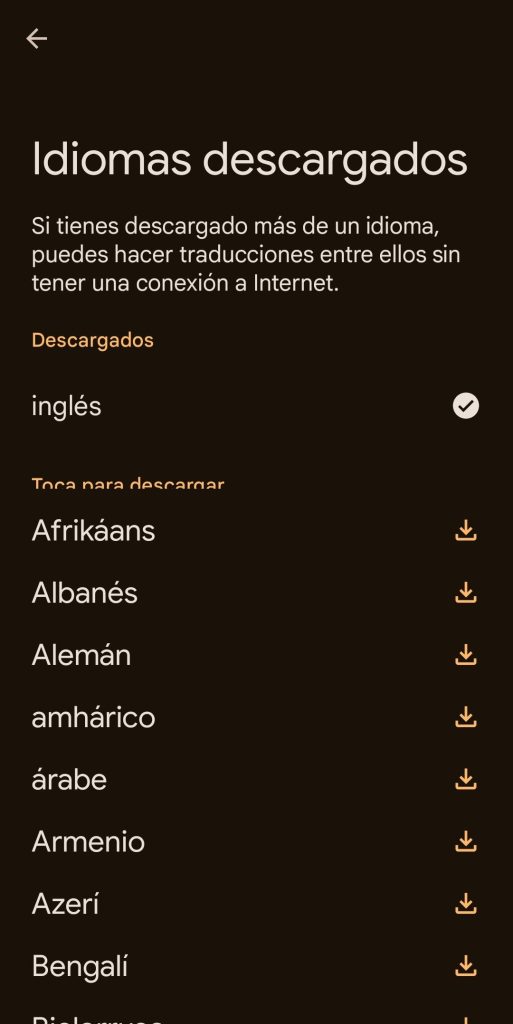 Se muestra la lista de idiomas descargados. A la derecha de cada idioma, hay un icono de descarga. En la parte superior izquierda de la pantalla, un icono en forma de flecha para retroceder a la pantalla anterior.